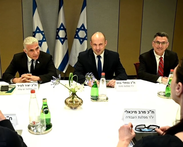 (L-R) Yesh Atid leader Yair Lapid, Yamina chair Naftali Bennett and New Hope head Gideon Sa'ar at a meeting of the heads of the would-be-coalition in Tel Aviv, June 6, 2021. (Yesh Atid Twitter feed)