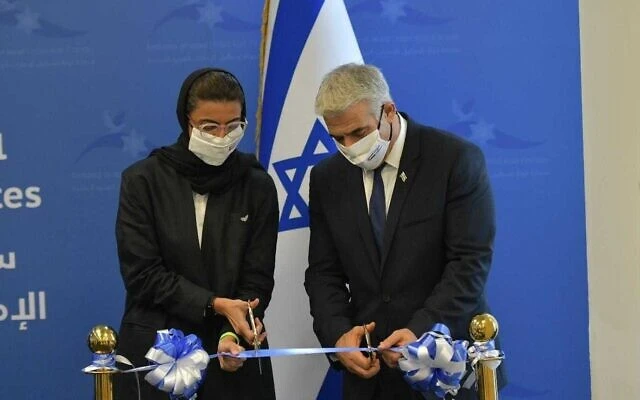 Foreign Minister Yair Lapid (R) and Emirati Culture Minister Noura Al Kaabi inaugurate the Israeli embassy in Abu Dhabi, June 29, 2021. (Shlomi Amsalem/GPO)