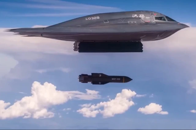 Screenshot of U.S. Air Force footage showing a B-2 Spirit stealth bomber dropping a GBU-57 Massive Ordnance Penetrator (MOP) bunker-buster bomb.