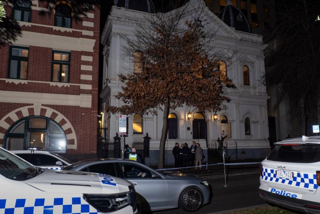 Police officers are seen collecting evidence at the scene. Police declared a crime scene after a suspected arson attempt at East Melbourne Hebrew Congregation. (Photo: Reuters)