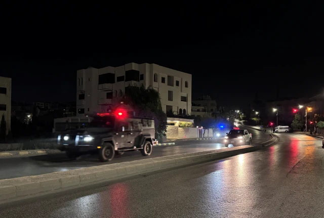 Police vehicles on a street near the Israeli embassy in Amman, Jordan November 24, 2024. 
REUTERS/Jehad Shelbak