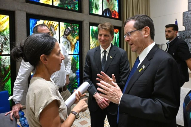 Israeli President Isaac Herzog (right) speaks with Rachel Goldberg-Polin as Dr. Benjamin Corn, looks on at the launch of Corn's new Institute for the Study of Hope at the President's Residence in Jerusalem on May 19, 2025. Photo: eJewish Philantropy