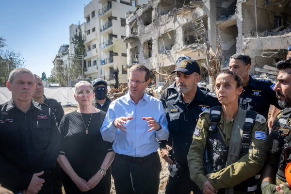 Israeli President Herzog visits impact site of Iranian missile in Tel Aviv, offers words of hope and peace