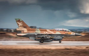 An Israeli Air Force fighter jet taxis on the runway, fully armed and ready for operations. Photo: IDF.