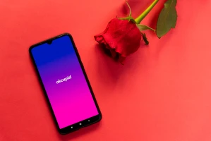 OkCupid dating app logo displayed on a mobile phone. Photo: Shutterstock