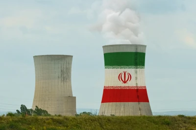 The flag of Iran is depicted on the cooling tower of the nuclear power plant. Photo: Shutterstock.