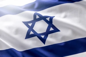 Israeli flag blowing in the wind - Close up. Photo: Shutterstock