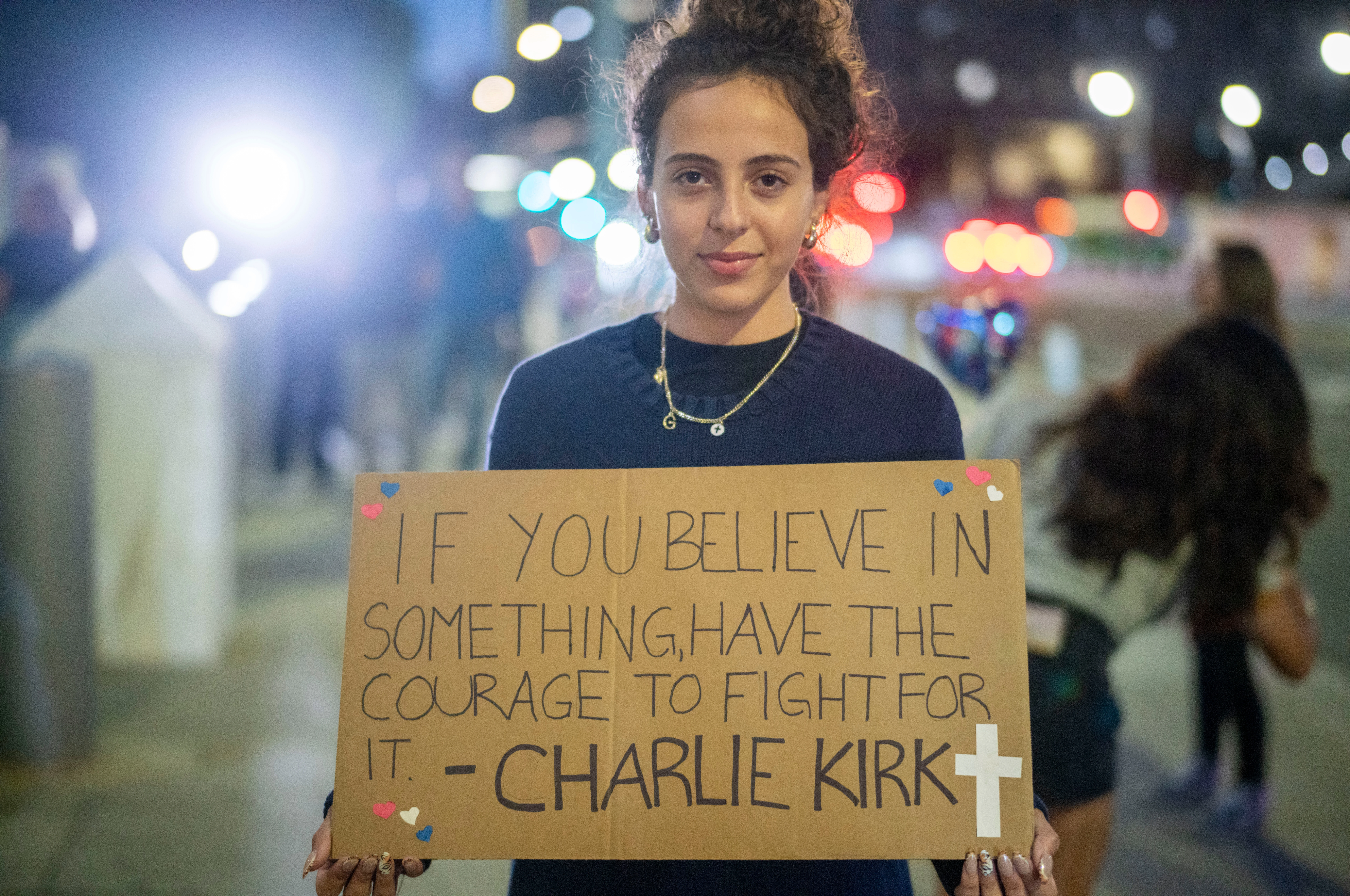 People attend a vigil for Charlie Kirk in Los Angeles on Sept. 11, 2025. Kirk was fatally shot a day earlier while speaking at Utah Valley University in Orem, Utah.