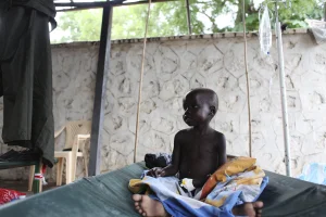 A South Sudanese child suffering from cholera sits on a bed in Juba Teaching Hospital in Juba, May 27, 2014. (Photo: Reuters)