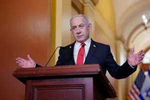 Israeli Prime Minister Benjamin Netanyahu addressing reporters next to the U.S. house speaker at the U.S. Capitol in Washington, U.S., February 7, 2025. REUTERS/Nathan Howard