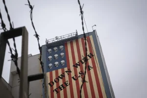 An anti-U.S. mural appears on a wall of a governmental building in downtown Tehran, Iran, on April 12, 2025, during the day of the Iran-U.S. nuclear discussions. According to Iranian officials, indirect nuclear discussions between Iran and the United States begin in Muscat, Oman, on April 12. (Photo by Morteza Nikoubazl/NurPhoto via Reuters Connect)
