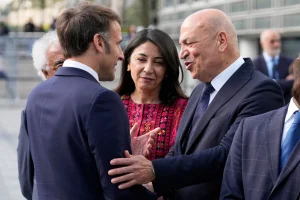French President Emmanuel Macron, shakes hands with Hani al-Hayek, the Palestinian Authority's minister for heritage and tourism, before visiting the exhibition "Treasures rescued from Gaza", at the Arab World Institute (IMA) in Paris, France April 14, 2025. Michel Euler/Pool via REUTERS