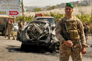 Lebanese soldiers secure the area where a SUV reportedly hit by an Israeli strike in Ghaziyeh, near the southern port city Sidon. Reuters