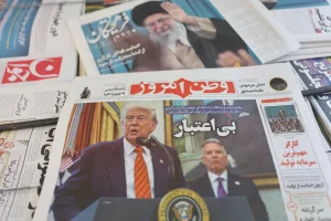 An Iranian newspaper with a cover photo of U.S. President Donald Trump and U.S. Middle East envoy Steve Witkoff, is seen in Tehran, Iran, May 11, 2025. Majid Asgaripour/WANA (West Asia News Agency) via REUTERS