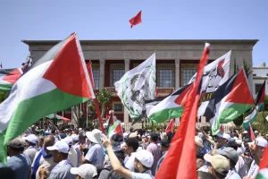 Palestinian and Moroccan flags wave during a national demonstration to denounce the starvation crisis in Gaza, in front of the Moroccan Parliament in Rabat Morocco on July 20 2025. Photo: Reuters