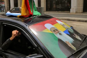 Car displaying on its wind shield the images of Muwaffaq Tarif [L], spiritual leader of the Druze community in Israel, and Hikmat al-Hijri, Syrian spiritual Druze leader, during a mass memorial mourning in the Lebanese city of Alliyeh for hundreds of Lebanese Druze who were killed in the sectarian fighting between Druze fighters and Sunni Muslim Bedouin gunmen in the southern Syria Sweida province on July 22, 2025. Photo: Marwan Naamani/ZUMA Press Wire via Reuters
