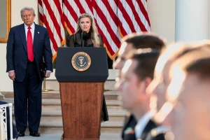 U.S. President Donald Trump stands beside Erika Kirk, wife of slain conservative commentator Charlie Kirk and the new CEO of Turning Point USA, as she delivers a speech during a ceremony to posthumously award the Medal of Freedom to Charlie Kirk in the Rose Garden at the White House in Washington, D.C., U.S., October 14, 2025. Photo: Reuters by Jonathan Ernst