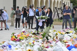 Israel’s Ambassador to Australia Amir Maimon places flowers at a makeshift memorial at Bondi Beach in Sydney, Tuesday, December 16, 2025 Photo: Reuters Connect by Mick Tsikas