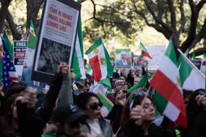 A moment of silence is held for the thousands recently killed in Iran during a protest calling for U.S. involvement against Iran's Islamic Republic regime in Houston, Texas, on January 18, 2026. (Photo by Reginald Mathalone/NurPhoto vua Reuters Connect)