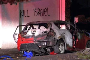 Tourched car and anti-Israel graffiti outside of Sydney, Australia (Photo: Social media)