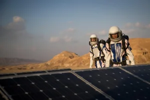 Israeli scientists walking near solar panels during a project simulates life in Mars, outside Mitzpe Ramon, Southern Israel, February 18, 2018, the D-MARS project is a a space analog research center in Israel, its founded by Israeli Space Agency and the Israeli Ministry of Science, Technology and Space. Photo by Yonatan Sindel/Flash90