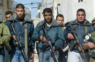 Zakaria Zubeidi, the West Bank leader of Palestinian militant group Al Aqsa Martyrs Brigades surrounded next to armed men in the West Bank city of Jenin, March 10, 2007. Photo by Nasser Ishtayeh/Flash90