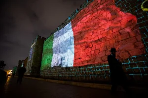 The Italian flag are screened on the walls of Jerusalem's Old City in solidarity with the Italian people, on March 15, 2020. Photo by Yontan Sindel/Flash90