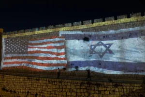 The USA and Israeli flags are screened on the walls of Jerusalem's Old City as a welcoming to US president Joe Biden , on July 13, 2022. Photo by Yonatan Sindel/Flash90