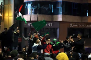 Palestinians celebrate following the deadly terror attack tonight, in the West Bank city of Hebron, January 27, 2023. Photo by Wisam Hashlamoun/Flash90