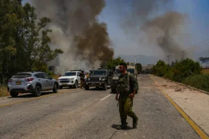 Israeli soldiers at the site where a large fire started from missiles launched from Lebanon near Kibbutz Kfar Szold, northern Israel, June 14, 2024 (Photo: Ayal Margolin/Flash90).