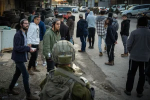 Jews pray at the scene where three Israelis were murdered in a shooting attack earlier today, near the village of al-Funduq, in the Northern West Bank, January 6, 2025. Photo by Erik Marmor/Flash90