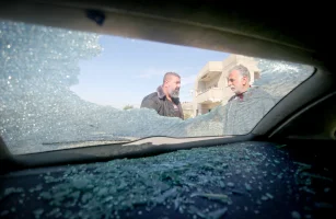 Palestinians inspect a car set ablaze by settlers overnight in the village of Burin near the Yitzhar settlement south of Nablus in the West Bank, after Palestinians celebrated a ceasefire between Israel and Hamas in Gaza on January 16, 2025.. Photo by Nasser Ishtayeh/Flash90