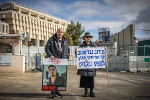Varda Ben Baruch, grandmother of Idan Alexander who are held hostage by Hamas terrorists in Gaza and Ofir Braslavski, whose son Rom held hostage in the Gaza Strip standing outside the Prime Minister's office in Jerusalem, January 23, 2025. Photo by Chaim Goldberg/Flash90