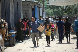 Palestinians receive food aid from the World Food Programme (WFP) at the Nuseirat Refugee Camp, in the central Gaza Strip, April 26, 2025. Photo by Ali Hassan/Flash90