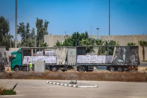 Trucks loaded with humanitarian aid seen before entering the Gaza Strip, on the Israeli side of the border with the Gaza Strip, May 20, 2025. Photo by Flash90