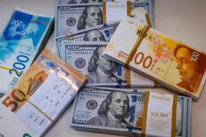 Illustration of American 100 dollar bills, 100 shekel bills and 50 euro bills, in Jerusalem, May 19, 2025. Photo by Nati Shohat/Flash90
