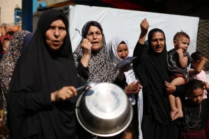 Palestinians demand the entry of humanitarian aid on July 20, 2025, in Gaza City. Photo by Ali Hassan/Flash90