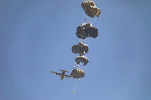 A plane drops humanitarian aid loaded with food supplies to displaced Palestinians in the northern Gaza Strip, July 27, 2025. Photo by Ali Hassan/Flash90