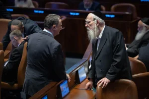 Minister of Defence Israel Katz speaks with MK's during a plenum session at the assembly hall of the Knesset, the Israeli parliament in Jerusalem, October 29, 2025. Photo by Chaim Goldbergl/Flash90