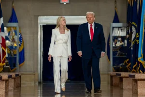 U.S. President Donald Trump walks with U.S. Attorney General Pam Bondi as he visits the Department of Justice to address its workers, in Washington, D.C., U.S., March 14, 2025. Photo: via the White House’s official X account.