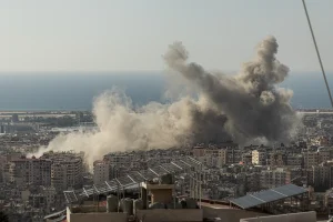 Dust rises above Beirut's Dahiyeh suburb after multiple Israeli airstrikes destroyed apartment buildings on Nov. 12, 2024. Photo by Collin Mayfield/Sipa USA via Reuters Connect