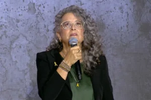Galit Dan speaks during the national memorial ceremony in Tel Aviv, marking two years since the October 7 massacre. (Screenshot from video on X, photo credit: National Memorial Ceremony)