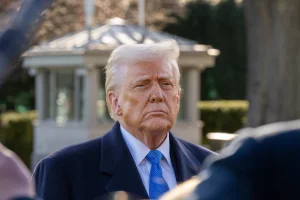 Washington Dc, United States, March 21 2025:President Donald Trump stops to speak with media before boarding Marine 1. Joey Sussman/Shutterstock.