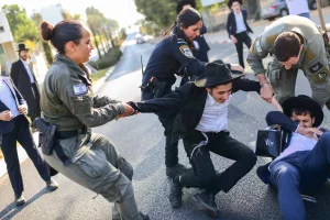 Ultra-orthodox Jews clash with police during a protest against the drafting of ultra-orthodox Jews to the Israeli army, outside the IDF Recruitment Center at Tel Hashomer, in central Israel, October 31, 2024. Photo by Tomer Neuberg/Flash90
