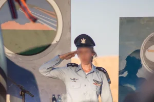 Illustration: Lt. Col. G., the first female commander of Nachshon Squadron, salutes during her appointment as commander of an operational base in the Israeli Air Force, March 2024. (Photo: IDF)