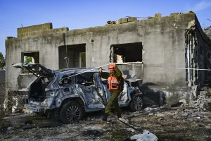 People look at the damage after a missile fired toward Israel overnight struck Zarzir, in northern Israel, March 13, 2026. Photo by Michael Giladi/Flash90