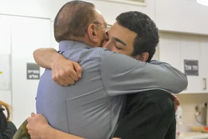 Staff Sgt. Edan Alexander embraces a family member during an emotional reunion at Tel Aviv Sourasky Medical Center, Israel, May 12, 2025. Photo: GPO