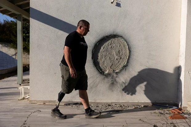 Avida Bachar walks past a damaged wall during an interview with Reuters nearly a year after his wife Dana and son Carmel were killed by Hamas militants during the deadly October 7 attack, in Kibbutz Beeri, southern Israel, September 26, 2024. (Photo: Amir Cohen/Reuters)