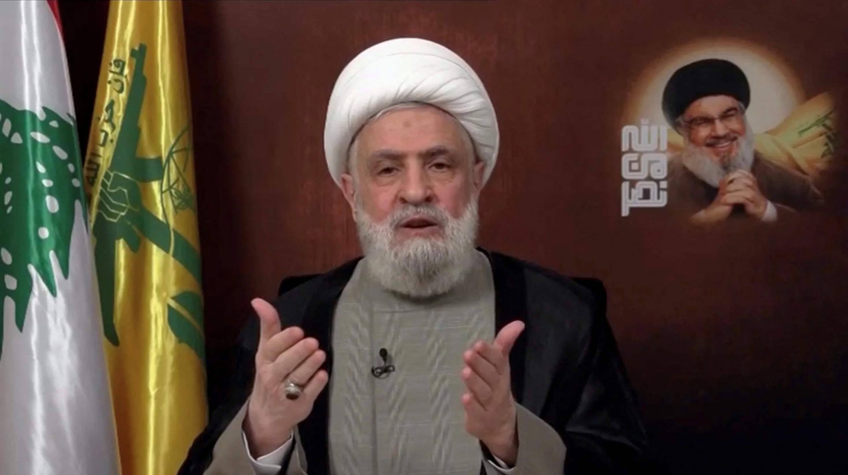 Lebanon's Hezbollah leader Sheikh Naim Qassem delivers an address from an unknown location, November 29, 2024, in this still image from video. Al Manar TV/Reuters TV via REUTERS