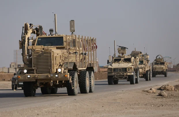 U.S. military vehicles drive in Hasaka, Syria December 6, 2024. REUTERS/Orhan Qereman